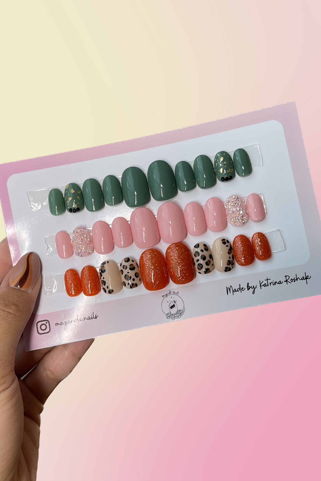 Three press on nail sets. First set is green with gold flakes and black diamonds. Second set is baby pink with pixie dust on the ring finger. Third set is orange and sparkly with cheetah print.